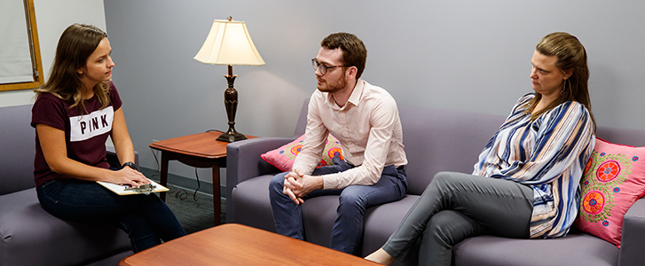 Counseling Lab team member talking to visitors